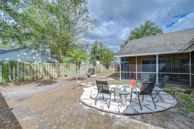 2020 Elk Spring Dr, Brandon, FL 33511 - view of patio / terrace featuring a sunroom, a fenced backyard, and a ceiling fan