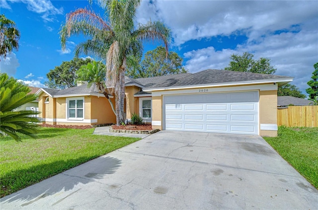 2020 Elk Spring Dr, Brandon, FL 33511 - single story home with stucco siding, concrete driveway, and a garage