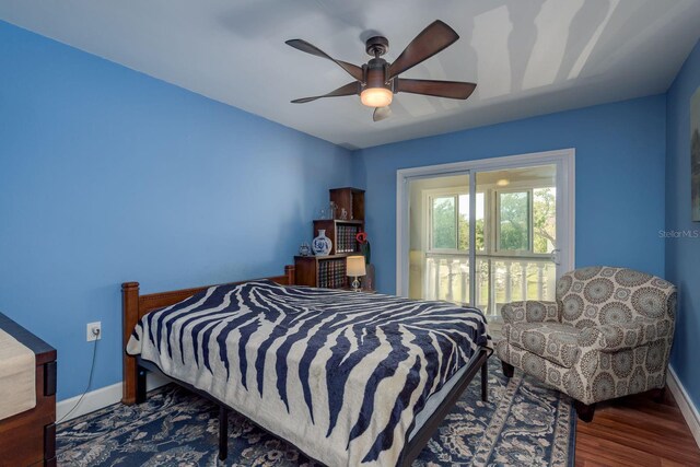 1250 S Pinellas Ave Unit 214, Tarpon Springs, FL 34689 - bedroom featuring wood finished floors, baseboards, and ceiling fan