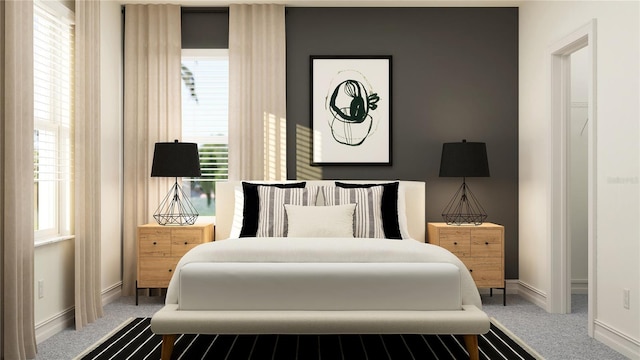 bedroom featuring multiple windows, carpet, and baseboards