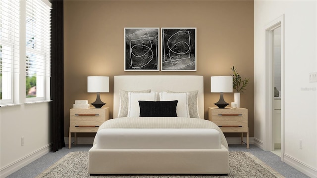 carpeted bedroom featuring baseboards