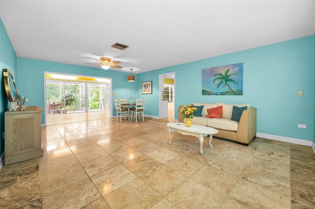 2485 Indigo Dr, Clearwater, FL 33763 - living room with baseboards and ceiling fan