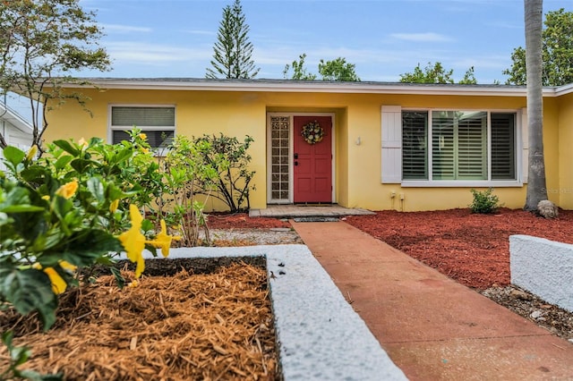 2485 Indigo Dr, Clearwater, FL 33763 - view of exterior entry featuring stucco siding