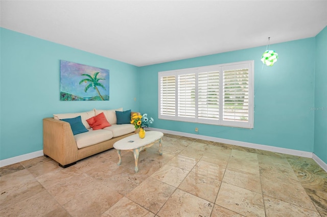 2485 Indigo Dr, Clearwater, FL 33763 - living area featuring baseboards and stone tile floors