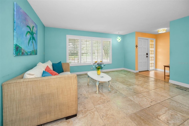 2485 Indigo Dr, Clearwater, FL 33763 - living room with baseboards and stone finish flooring