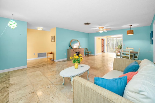 2485 Indigo Dr, Clearwater, FL 33763 - living room with a ceiling fan and baseboards