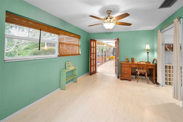 2485 Indigo Dr, Clearwater, FL 33763 - office featuring wood finished floors, a ceiling fan, and baseboards