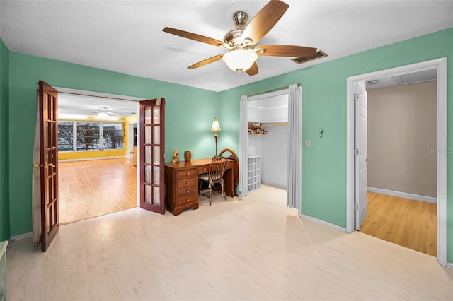2485 Indigo Dr, Clearwater, FL 33763 - office space featuring wood finished floors, a ceiling fan, french doors, and baseboards