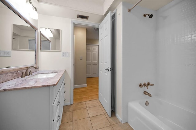 2485 Indigo Dr, Clearwater, FL 33763 - full bath featuring shower / washtub combination, tile patterned floors, vanity, and baseboards
