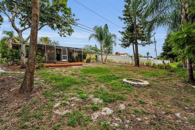 2485 Indigo Dr, Clearwater, FL 33763 - view of yard featuring a fire pit, fence, and a lanai