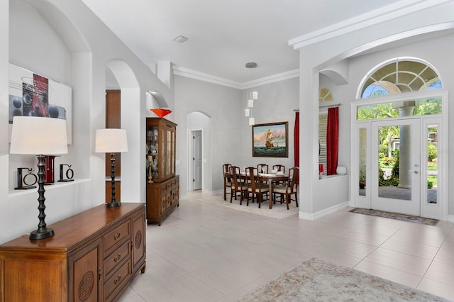 17318 Emerald Chase Dr, Tampa, FL 33647 - entryway with arched walkways, light tile patterned floors, and ornamental molding