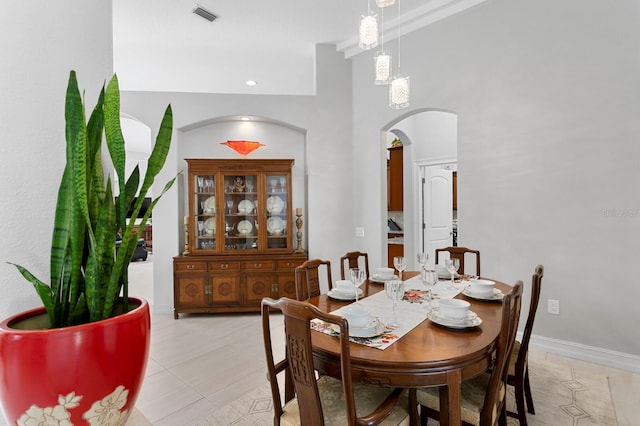 17318 Emerald Chase Dr, Tampa, FL 33647 - dining room featuring arched walkways and light tile patterned floors