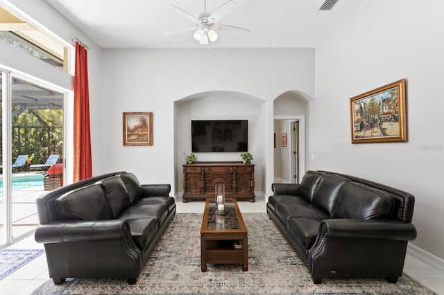 17318 Emerald Chase Dr, Tampa, FL 33647 - tiled living room featuring a ceiling fan and arched walkways