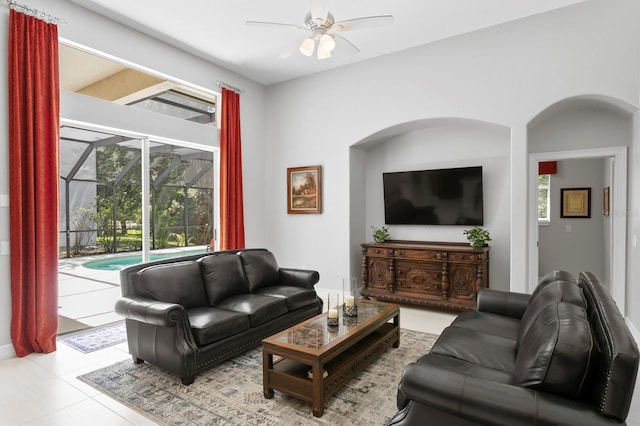 17318 Emerald Chase Dr, Tampa, FL 33647 - tiled living room with ceiling fan, plenty of natural light, and arched walkways