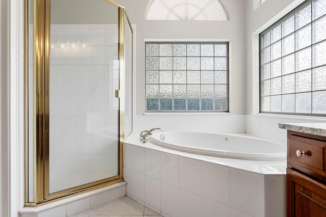 17318 Emerald Chase Dr, Tampa, FL 33647 - bathroom featuring a garden tub, a stall shower, vanity, and tile patterned flooring