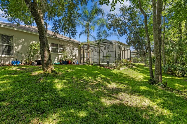 17318 Emerald Chase Dr, Tampa, FL 33647 - view of green lawn with glass enclosure