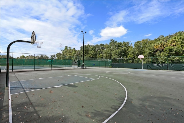 17318 Emerald Chase Dr, Tampa, FL 33647 - view of sport court featuring community basketball court, fence, and a tennis court