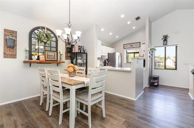 5666 Gardens Dr Unit 202, Sarasota, FL 34243 - dining space with recessed lighting, a chandelier, dark wood-type flooring, baseboards, and high vaulted ceiling