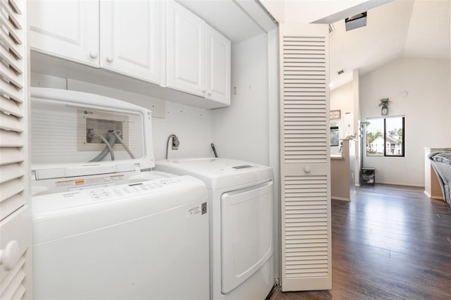 5666 Gardens Dr Unit 202, Sarasota, FL 34243 - clothes washing area featuring cabinet space, washing machine and clothes dryer, dark wood-style floors, and baseboards