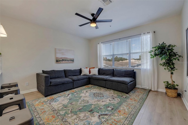 330 Lang Ct N Unit 1, Saint Petersburg, FL 33701 - living room featuring wood finished floors, ceiling fan, and baseboards