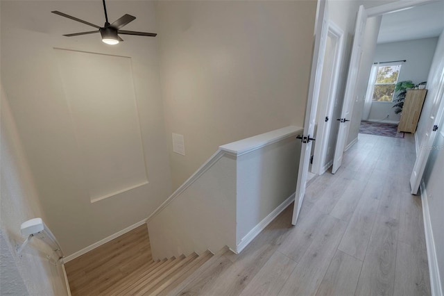 330 Lang Ct N Unit 1, Saint Petersburg, FL 33701 - hallway featuring an upstairs landing, light wood-style floors, and baseboards
