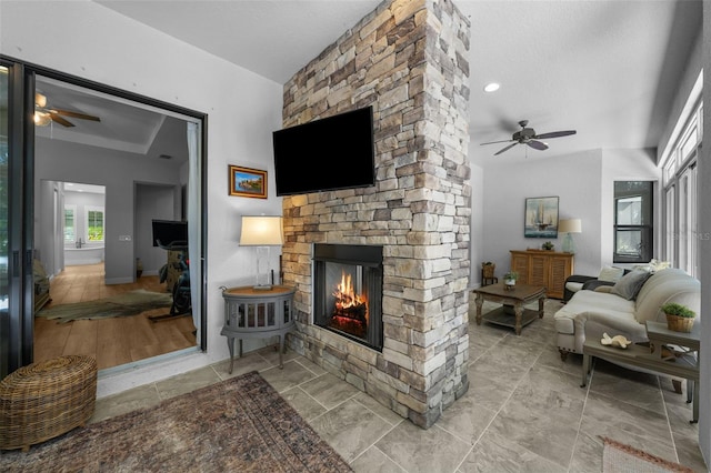 12705 Green Heron Way, Odessa, FL 33556 - living room featuring a ceiling fan and a fireplace