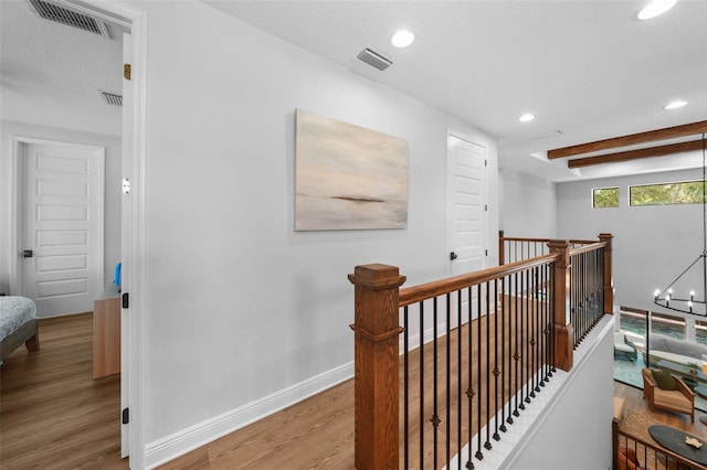 12705 Green Heron Way, Odessa, FL 33556 - corridor featuring wood finished floors, an upstairs landing, recessed lighting, baseboards, and a chandelier