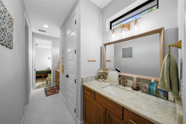 12705 Green Heron Way, Odessa, FL 33556 - bathroom with vanity, baseboards, and recessed lighting