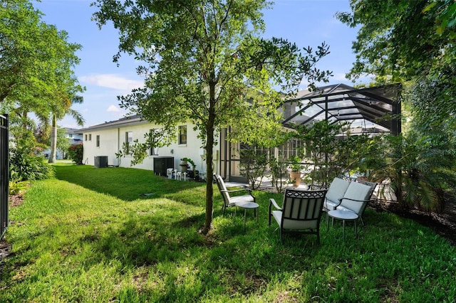 12705 Green Heron Way, Odessa, FL 33556 - view of green lawn with a lanai and central air condition unit