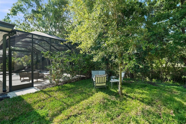 12705 Green Heron Way, Odessa, FL 33556 - view of green lawn featuring a patio and glass enclosure