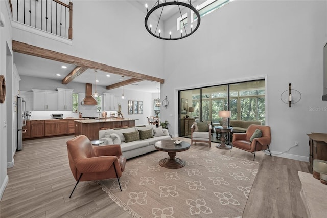 12705 Green Heron Way, Odessa, FL 33556 - living area with a chandelier, light wood-style floors, baseboards, a high ceiling, and beam ceiling