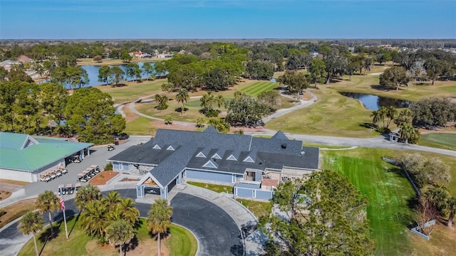 12705 Green Heron Way, Odessa, FL 33556 - drone / aerial view of a golf course, a nearby body of water, and a tree filled landscape