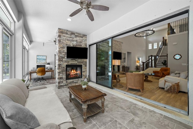 12705 Green Heron Way, Odessa, FL 33556 - living area featuring a fireplace, a ceiling fan, stairway, an office area, and recessed lighting