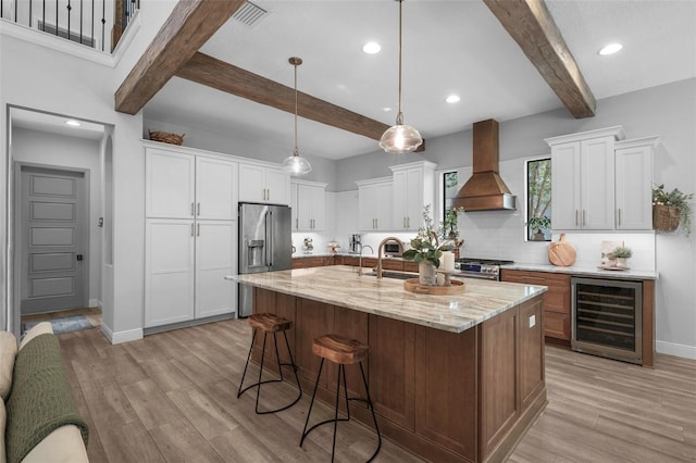 12705 Green Heron Way, Odessa, FL 33556 - kitchen featuring wine cooler, custom exhaust hood, beam ceiling, high end appliances, and baseboards