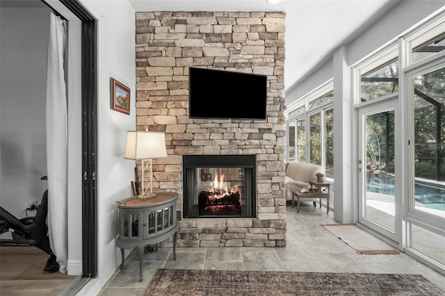 12705 Green Heron Way, Odessa, FL 33556 - living room with a stone fireplace and stone finish flooring