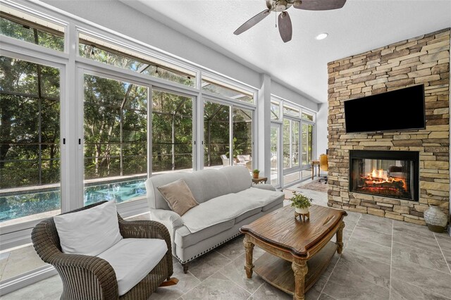 12705 Green Heron Way, Odessa, FL 33556 - sunroom with french doors, ceiling fan, and an outdoor living space with a fireplace