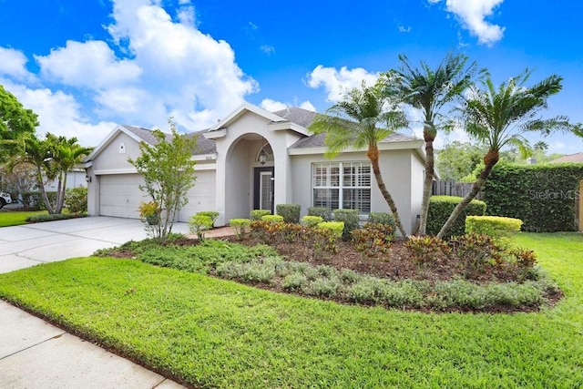 ranch-style house featuring stucco siding, a garage, and driveway
