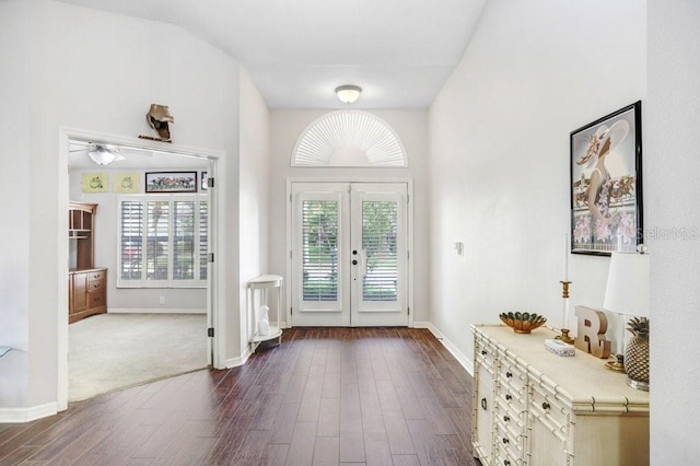 entryway with dark wood-style flooring, french doors, and baseboards