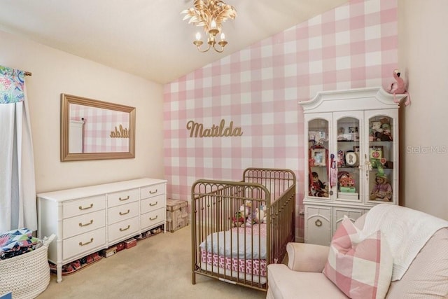 carpeted bedroom with a chandelier and wallpapered walls