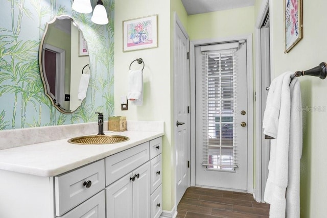 bathroom featuring wood finished floors and vanity