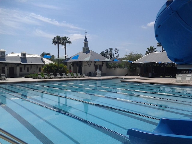 community pool with a patio area