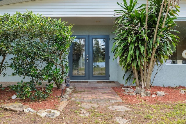 2814 W Humphrey St, Tampa, FL 33614 - view of exterior entry with french doors and stucco siding