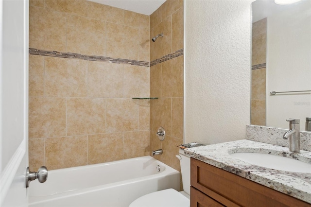 2814 W Humphrey St, Tampa, FL 33614 - full bathroom with shower / washtub combination, a textured wall, toilet, and vanity