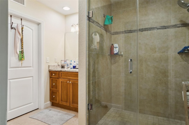 2814 W Humphrey St, Tampa, FL 33614 - bathroom featuring vanity, a shower stall, and tile patterned floors