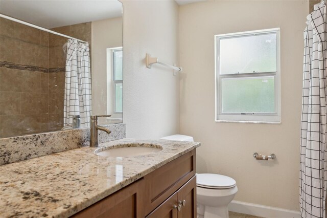 2814 W Humphrey St, Tampa, FL 33614 - bathroom featuring toilet, vanity, and a shower with shower curtain