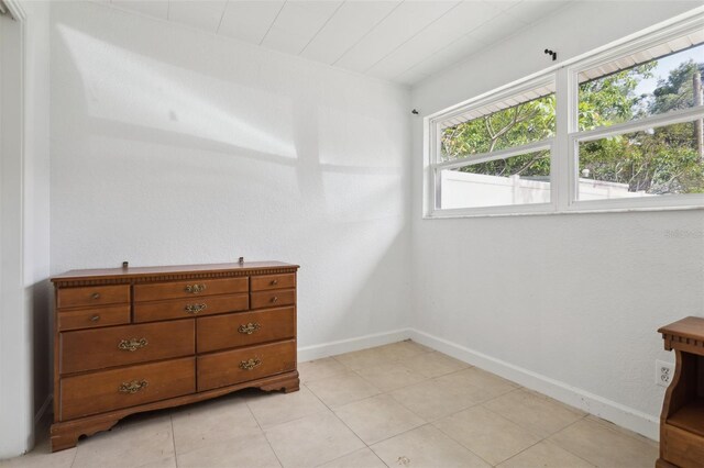 2814 W Humphrey St, Tampa, FL 33614 - bedroom featuring baseboards and light tile patterned flooring