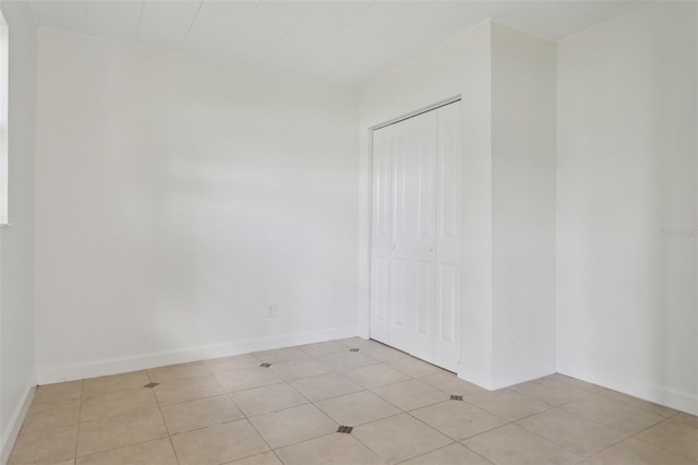 2814 W Humphrey St, Tampa, FL 33614 - empty room featuring baseboards and light tile patterned flooring