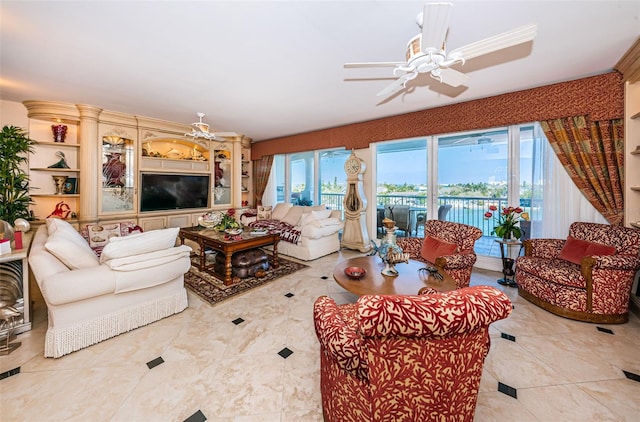 living area with a ceiling fan and light tile patterned floors