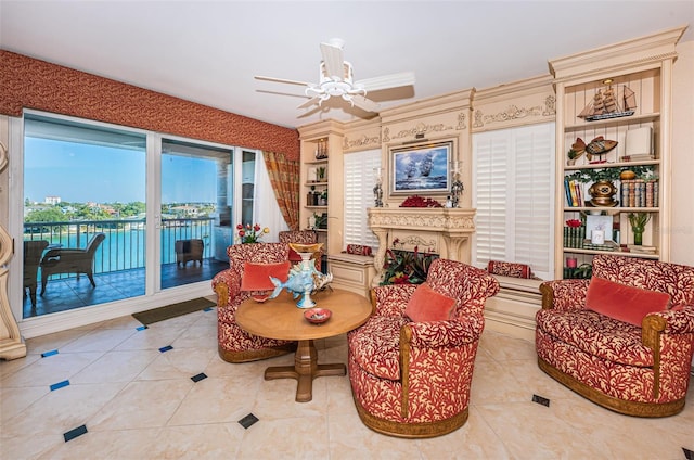 sitting room featuring ceiling fan and light tile patterned flooring