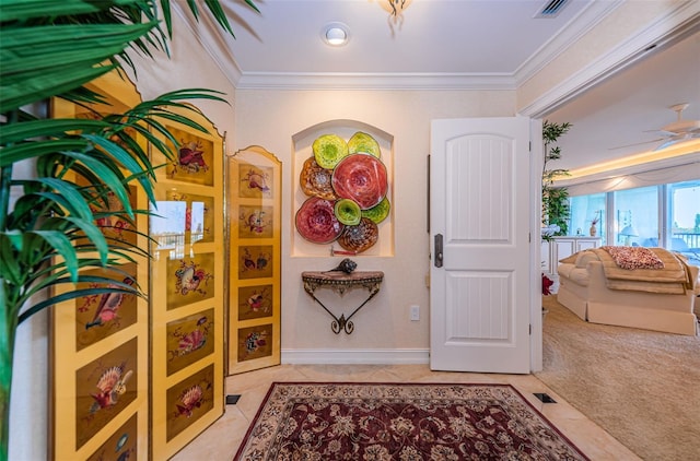 entryway featuring ornamental molding and light tile patterned floors